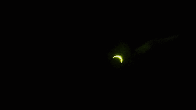 The partial eclipse through welding glass